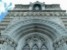 neogotycka fasada kościoła na szczycie figura Matki Boskiej z Lourdes