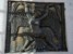 relief przedstawiający kobietę-demona